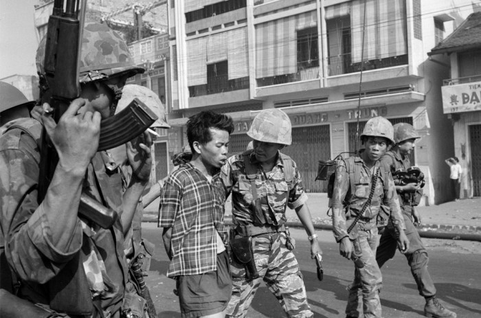 (1 of 3) South Vietnamese forces escort suspected Viet Cong officer Nguyen Van Lem (also known as Bay Lop) on a Saigon street Feb. 1, 1968, early in the Tet Offensive. (AP Photo/Eddie Adams)