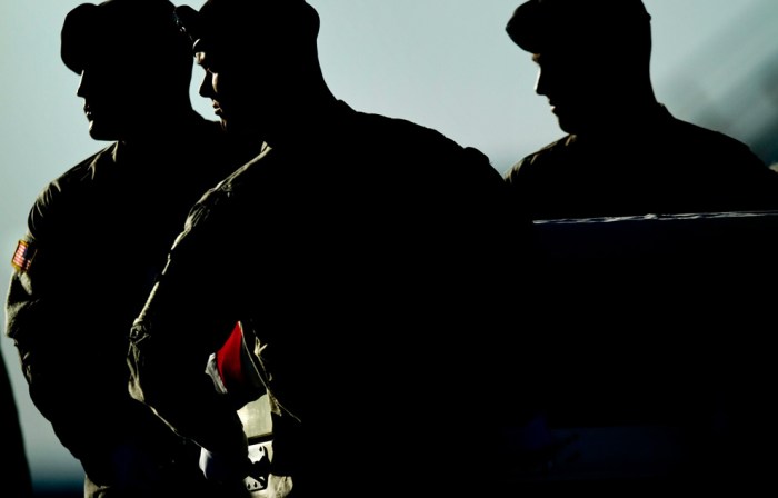 An Army carry team moves a transfer case with the remains of Army Specialist Matthew R. Hennigan, of Las Vegas, Nevada, who died in Operation Enduring Freedom, during a dignified transfer at Dover Air Force Base on July 2, 2010 in Dover, Delaware. (Brendan Smialowski/Getty Images)